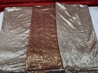 Three folded sequin panels in rose gold and champagne tones