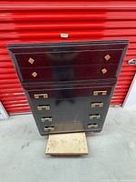 Front view of dresser showing six drawers and brass pulls