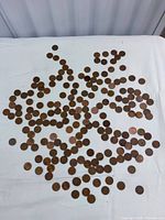 Wide view of entire spread of Canadian pennies on cloth