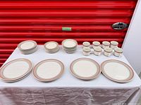 Full set on table showing counts of plates, bowls, cups