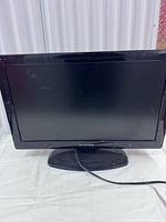 Front view of Lloyd’s 22-inch LCD TV/DVD combo on stand