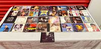 All 33 CDs laid out on table