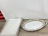 Tray next to packaging showing overall design and size context
