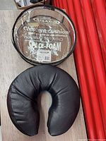Cushion front view beside storage case