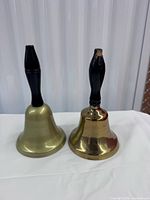 Front view of both brass hand bells