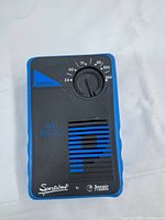 Front view of Prosonic Sportabout AM radio showing tuning dial and speaker grille