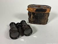 Opera glasses front view with case