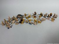 Group shot of all Wade miniature figurines laid out