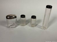 All four glass bottles/jars with lids