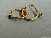 Pair of gold hoops showing overall design