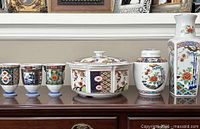 Entire lot showing casserole, ginger jar, vase and three cups