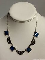 Full view of necklace displayed on bust form