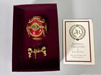 egg, stand, box interior and COA