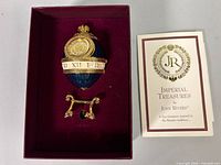 Egg clock on stand inside presentation box with C.O.A.