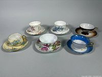 Group view of six assorted teacup and saucer sets