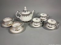 Group view of teapot, teacups and saucers