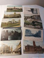 Overview of all ten British postcards laid out on table