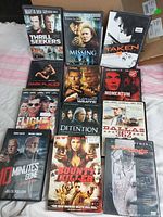 All 12 DVD cases displayed on surface