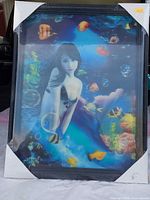 Full shot of framed mermaid lenticular picture with protective corners