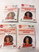 Group of four sealed Team Canada 2002 pins on cards