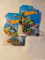 Both blister-packed Hot Wheels cars overlapped