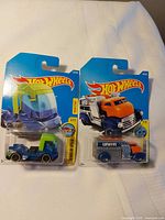 Front of both sealed Hot Wheels cards showing Big Heat and Fast Gassin’ models