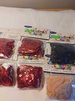 Front view of six sealed Miracle Crafts sequin packages
