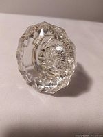 Oblique view showing faceted glass face and starburst center