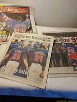 Overall view of three publications on table