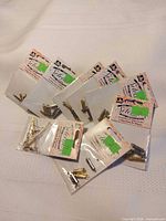 Group shot of nine unopened JB Selection jewellery component packages
