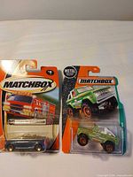 Both Matchbox vehicles sealed in packaging