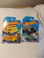 Front view of both blister-carded Hot Wheels cars