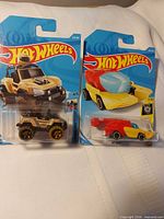 Both 2017 Hot Wheels cars in sealed blister cards