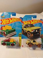Both Hot Wheels cars on cards side by side
