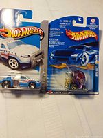 Front view of both Hot Wheels vehicles in packaging