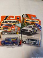 Both packaged Matchbox vehicles side by side