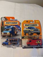 Front view of both sealed Matchbox vehicles in packaging