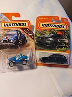 Both carded Matchbox vehicles front view