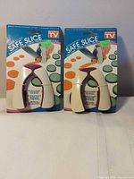 Two packaged Safe Slice finger guards front view
