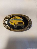 Front view showing school bus design and brass laurel border