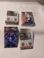 Four stacks of 2016-17 Tim Hortons NHL cards on table