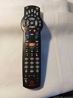 Front view of Rogers remote showing buttons and logo