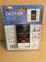 Front view of sealed Digitape Plus package showing device and branding