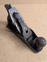 Oblique view of full plane showing overall form, knob, tote area and sole