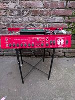 Front angled view of SWR Super Redhead amplifier chassis on stand