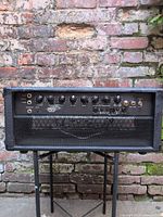 Front view of Traynor YBA200 bass head on stand