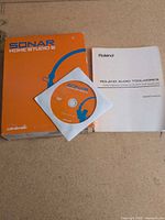 Sonar Home Studio 6 box, installation DVD and Roland Audio Toolworks manual displayed on surface