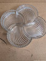 Top view showing entire clear glass four-petal dish