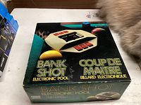 Front of bilingual retail box showing Bank Shot Electronic Pool graphics