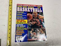 Front cover with title, Grant Hill image and ruler for scale